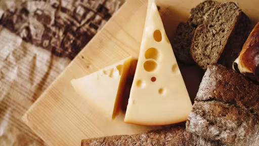 sliced-cheese-brown-table-top-821365.jpg
