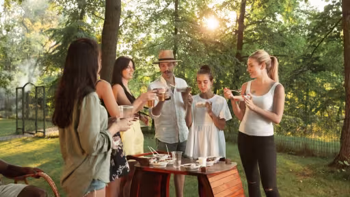 happy-friends-eating-drinking-beers-barbecue-dinner-sunset-time-1-1.jpg